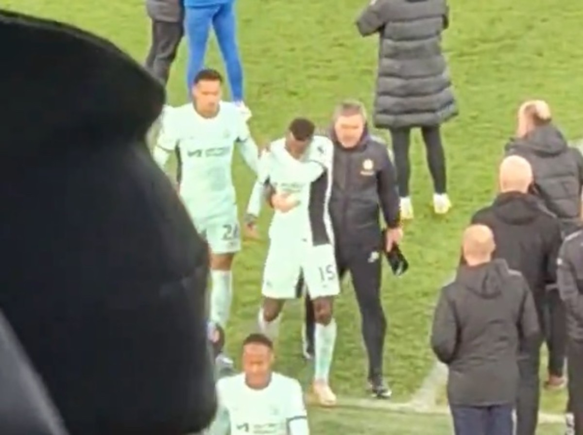 Nicolas Jackson pictured (center) being dragged off the field by a member of Chelsea's coaching staff following a 2-0 loss at Everton in December 2023