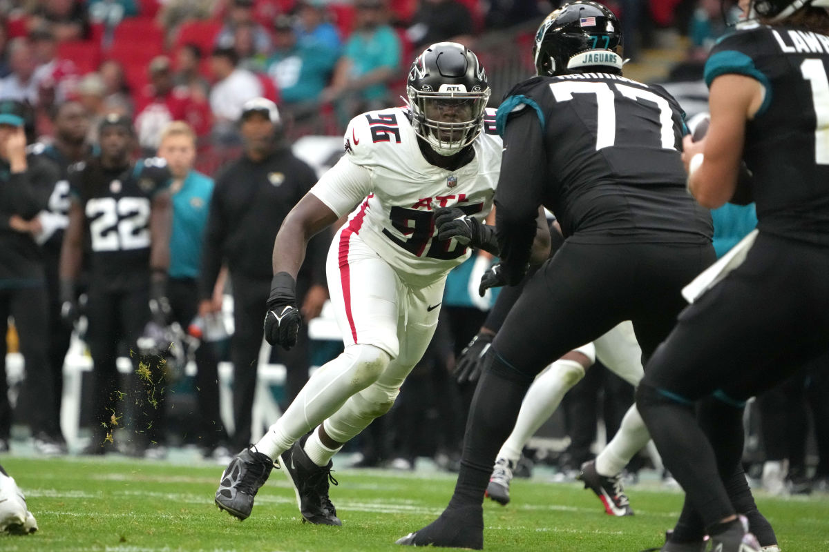 Atlanta Falcons defensive end Zach Harrison (96) attempts to get past Jacksonville Jaguars offensive tackle Anton Harrison (77) in the second half during an NFL International Series game at Wembley Stadium.