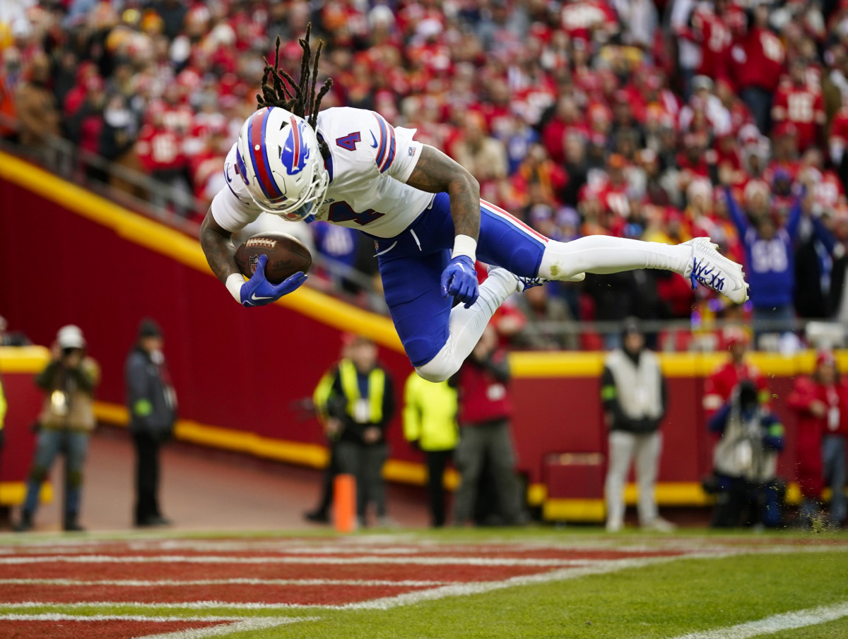 Bills RB James Cook leaps into the end zone as he scores against the Kansas City Chiefs.