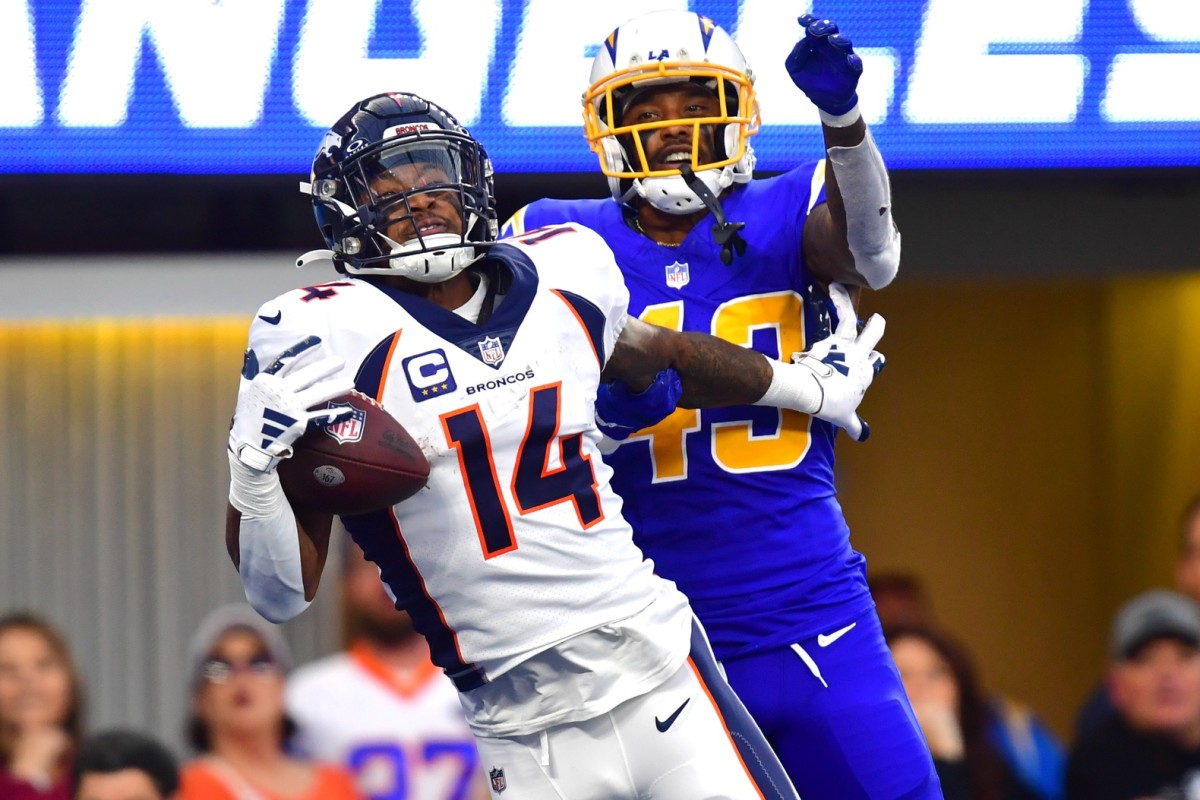 Denver Broncos wide receiver Courtland Sutton (14) catches a touchdown pass against Los Angeles Chargers cornerback Michael Davis (43) during the second half at SoFi Stadium.