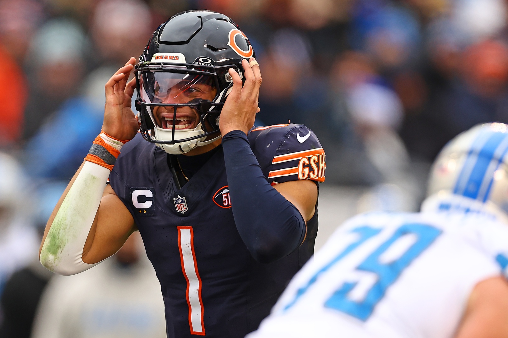 Dec 10, 2023; Chicago, Illinois, USA; Chicago Bears quarterback Justin Fields (1) reacts against the Detroit Lions during the first half at Soldier Field. Mandatory Credit: Mike Dinovo-USA TODAY Sports
