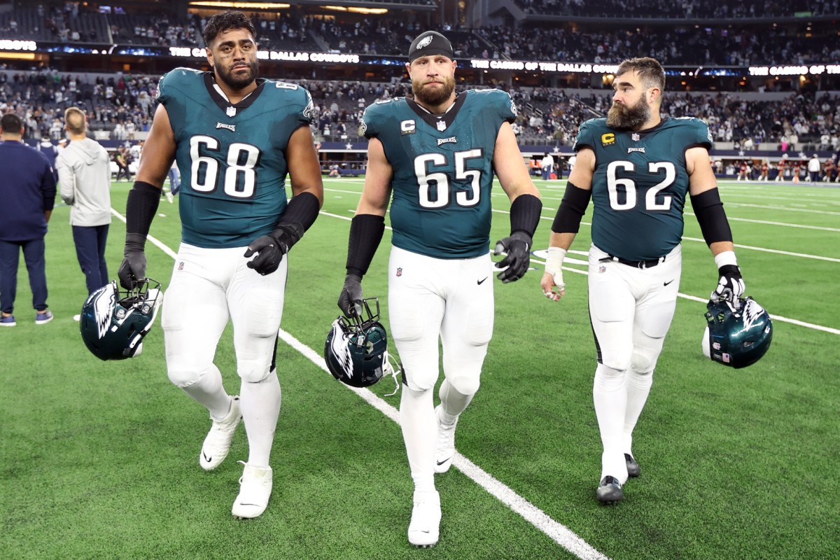 Philadelphia Eagles offensive tackle Jordan Mailata (68) and offensive tackle Lane Johnson (65) and center Jason Kelce (62) walk off the field after their loss to the Dallas Cowboys at AT&T Stadium.