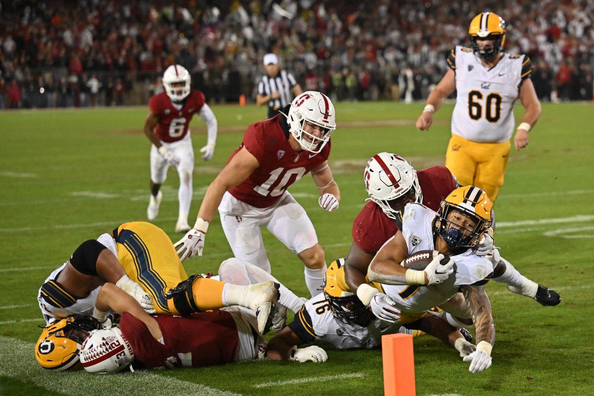 Nov 18, 2023; Stanford, California, USA; California Golden Bears running back Jaydn Ott (1) extends with the ball toward the goal line against the Stanford Cardinal during the third quarter at Stanford Stadium. Mandatory Credit: Robert Edwards-USA TODAY Sports