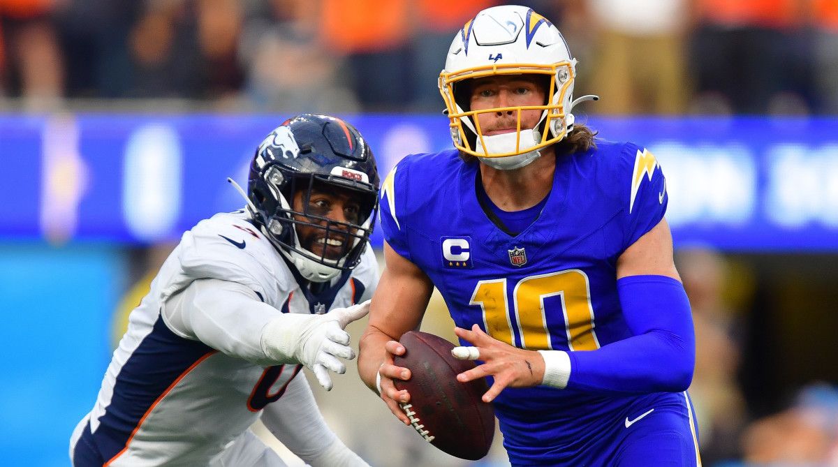 Chargers quarterback Justin Herbert, right, moves out to pass against trailing Broncos linebacker Jonathon Cooper