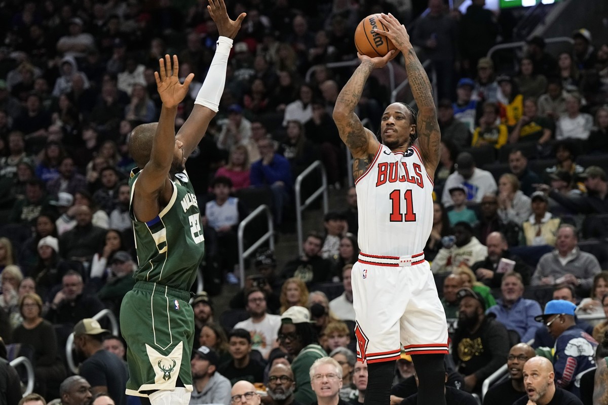 Chicago Bulls forward DeMar DeRozan (11) shoots against Milwaukee Bucks forward Khris Middleton (22) during the second quarter at Fiserv Forum. 