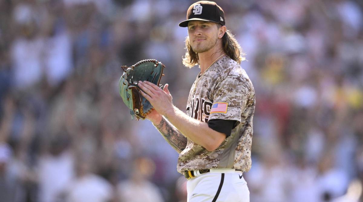 Padres closer Josh Hader claps his glove after a win.