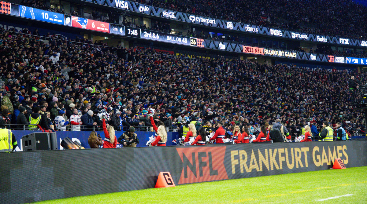 a stadium full of fans with NFL Frankfurt Games written on the side barrier