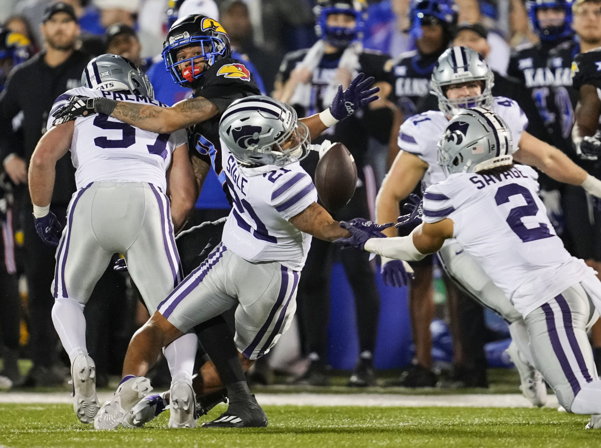 Kansas State Wildcats safety Kobe Savage (2) dives for a pass against the Kansas Jayhawks.