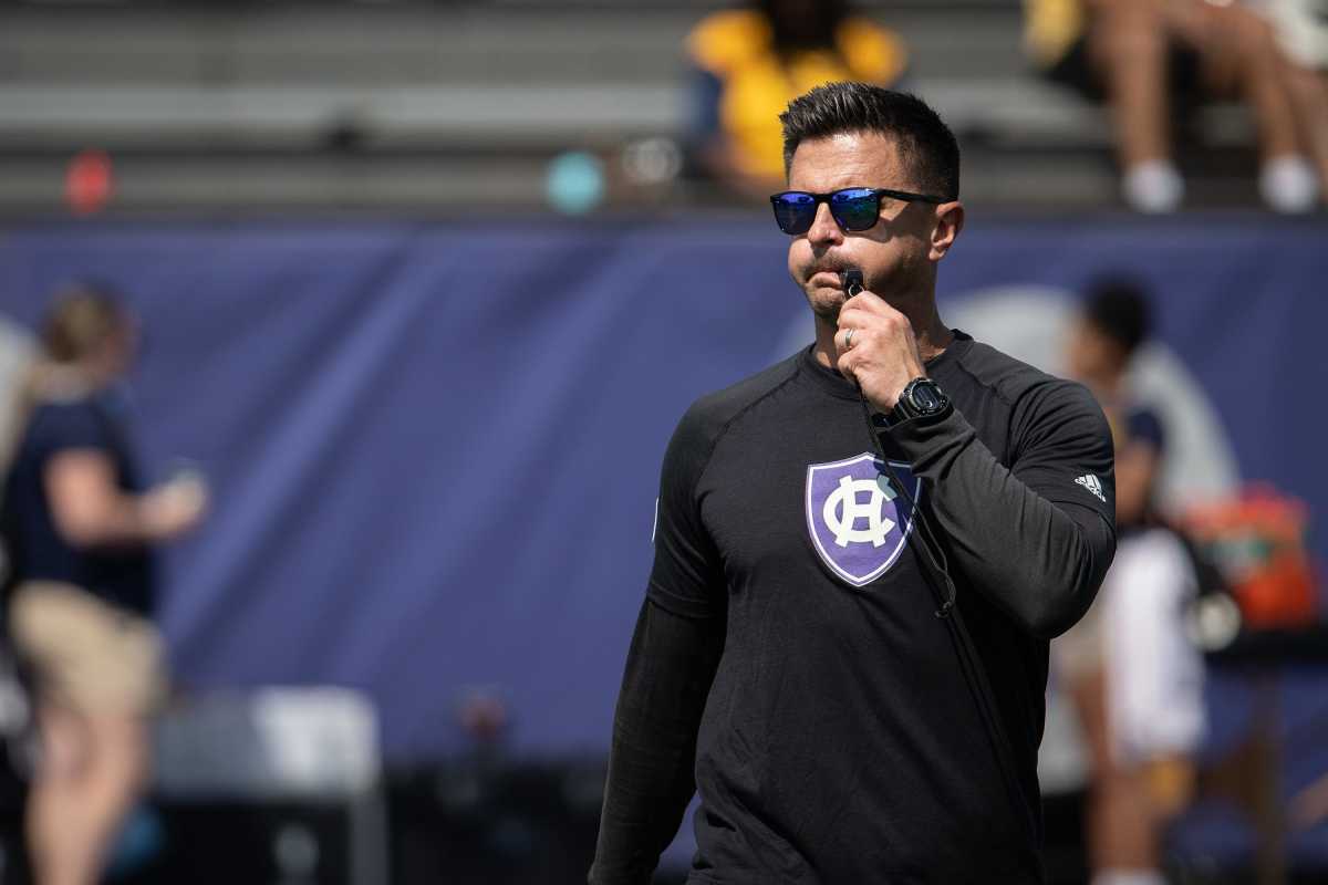 Holy Cross coach Bob Chesney blows his whistle to end warmups before Saturday's game at Fitton Field.