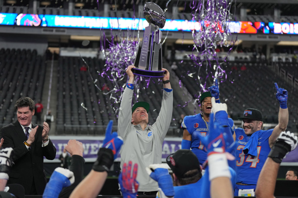 Dec 2, 2023; Las Vegas, NV, USA; Boise State Broncos head coach Spencer Danielson holds the Craig Thompson tropny after 44-20 victory over the UNLV Rebels in the Mountain West Championship at Allegiant Stadium. Mandatory Credit: Kirby Lee-USA TODAY Sports