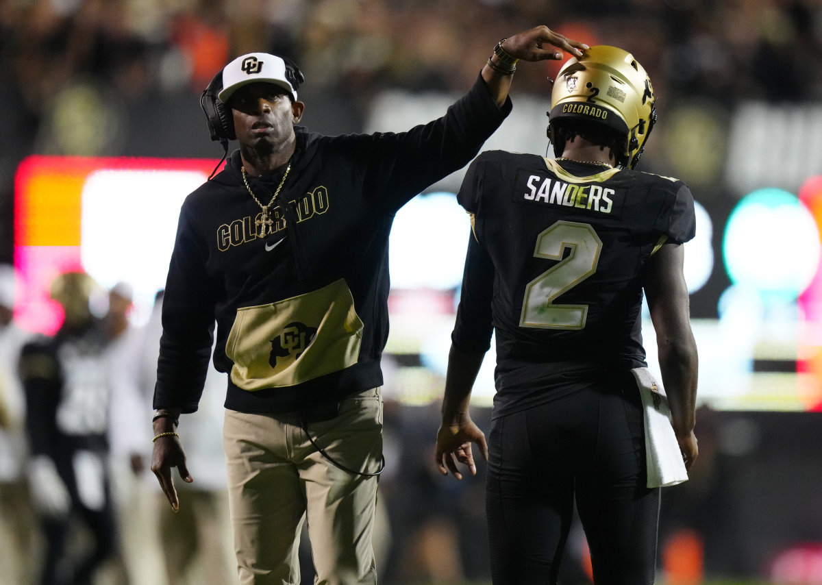 Sep 16, 2023; Boulder, Colorado, USA; Colorado Buffaloes quarterback Shedeur Sanders (2) and head coach Deion Sanders following a two point conversion in the fourth quarter against the Colorado State Rams at Folsom Field