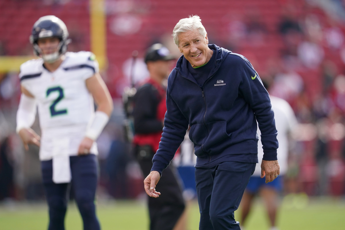 Pete Carroll looks to the side and smiles