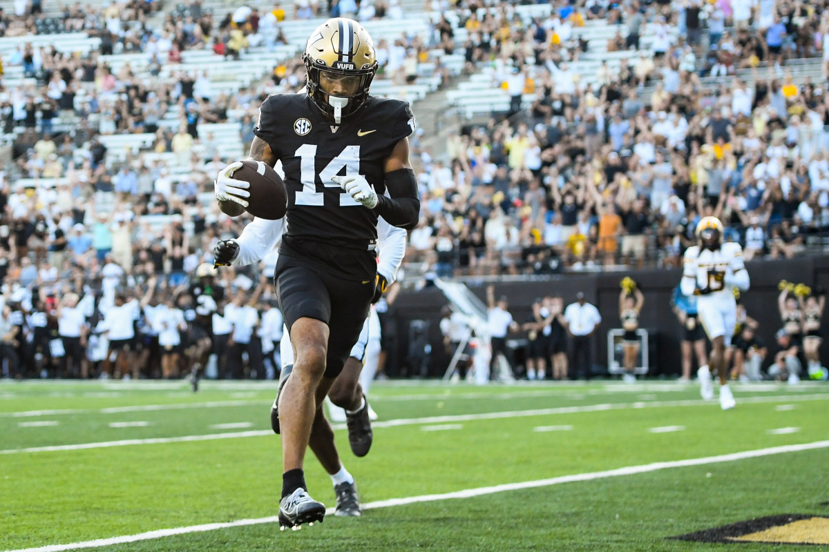 Nashville, Tennessee, USA; Vanderbilt Commodores wide receiver Will Sheppard (14) scores a touchdown against the Missouri Tigers during the second half at FirstBank Stadium