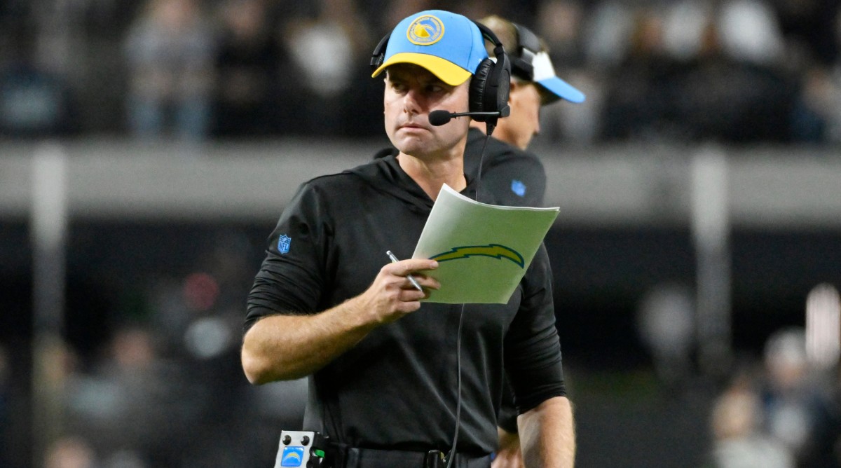 Chargers head coach Brandon Staley looks away from his play sheet during a game against the Raiders.