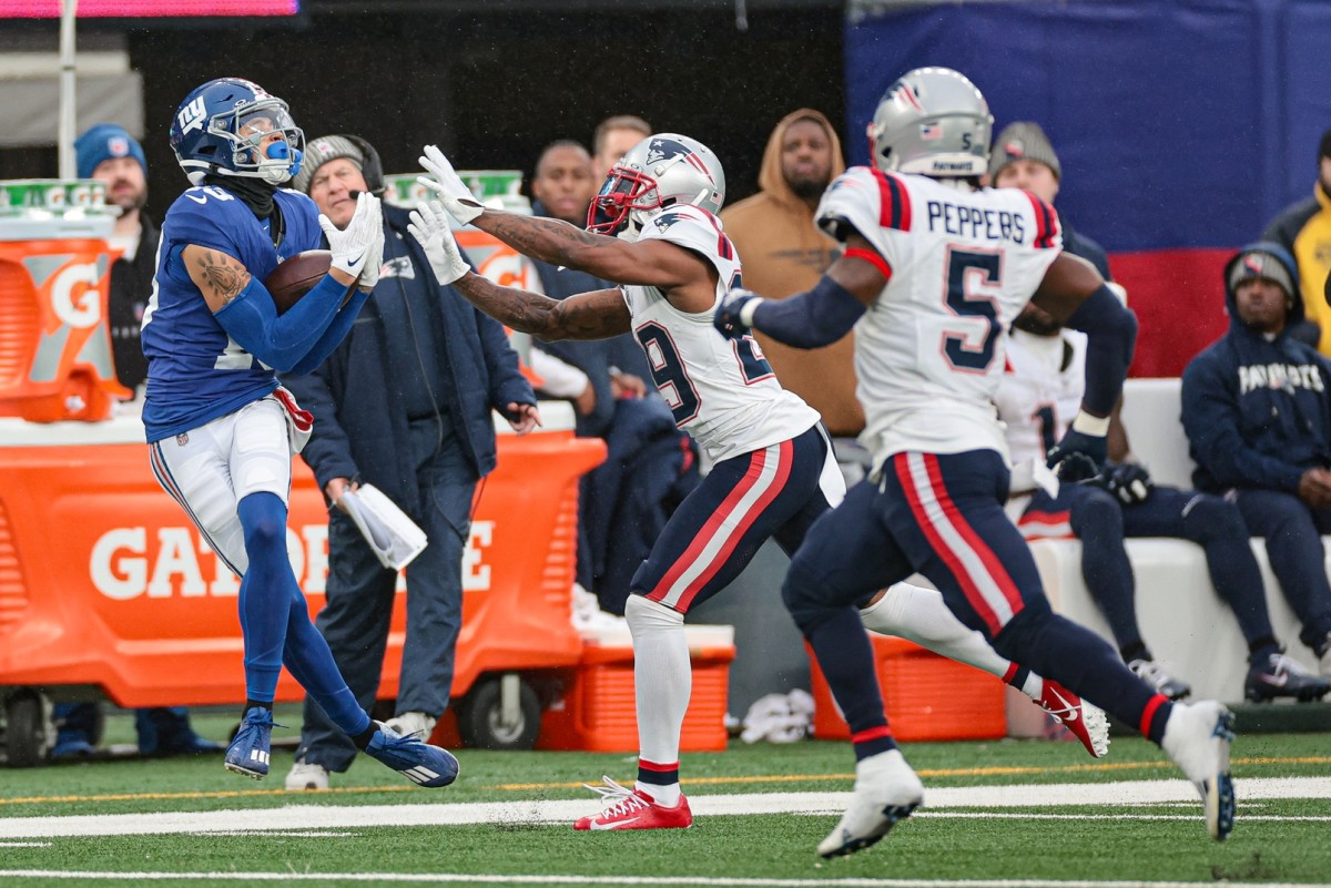 New York Giants wide receiver Jalin Hyatt (13) makes a catch behind New England Patriots cornerback J.C. Jackson (29) and safety Jabrill Peppers (5). Mandatory Credit: Vincent Carchietta-USA TODAY Sports