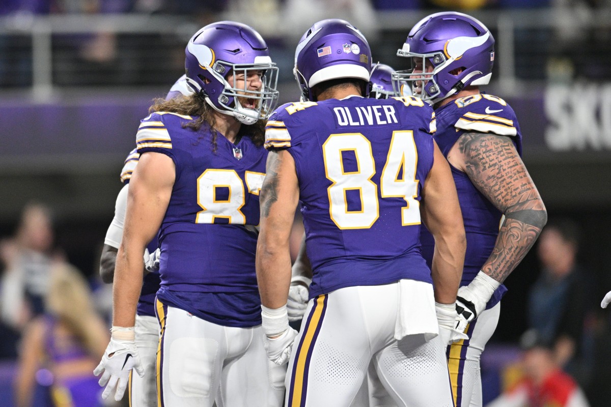 Nov 27, 2023; Minneapolis, Minnesota, USA; Minnesota Vikings tight end T.J. Hockenson (87) reacts with tight end Josh Oliver (84) and guard Dalton Risner (66) after a touchdown against the Chicago Bears during the fourth quarter at U.S. Bank Stadium.