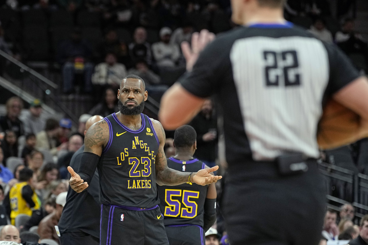 Dec 15, 2023; San Antonio, Texas, USA; Los Angeles Lakers guard LeBron James (23) argues a call with official JB DeRosa (22) during the first half against the San Antonio Spurs at Frost Bank Center.
