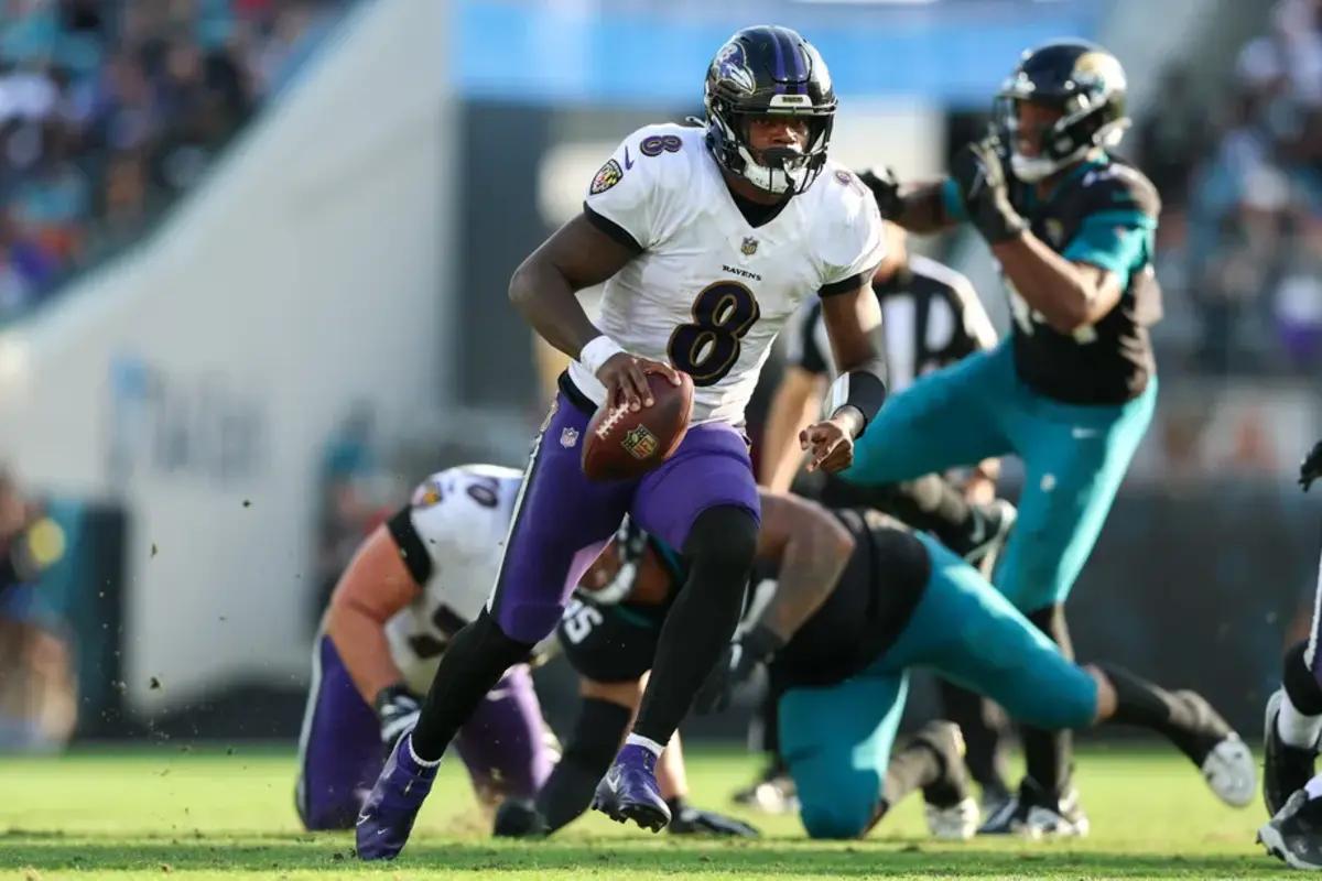 Ravens quarterback Lamar Jackson takes off during last year's game against the Jaguars.