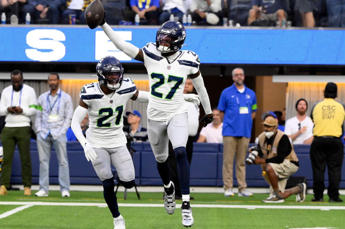 Seattle Seahawks cornerback Riq Woolen (27) celebrates making an interception against the Los Angeles Rams in the fourth quarter at SoFi Stadium.