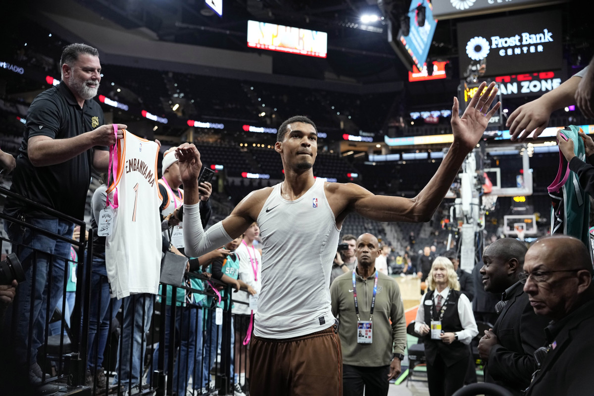 Dec 15, 2023; San Antonio, Texas, USA; San Antonio Spurs forward Victor Wembanyama (1) greets fans before the game against the Los Angeles Lakers at Frost Bank Center.