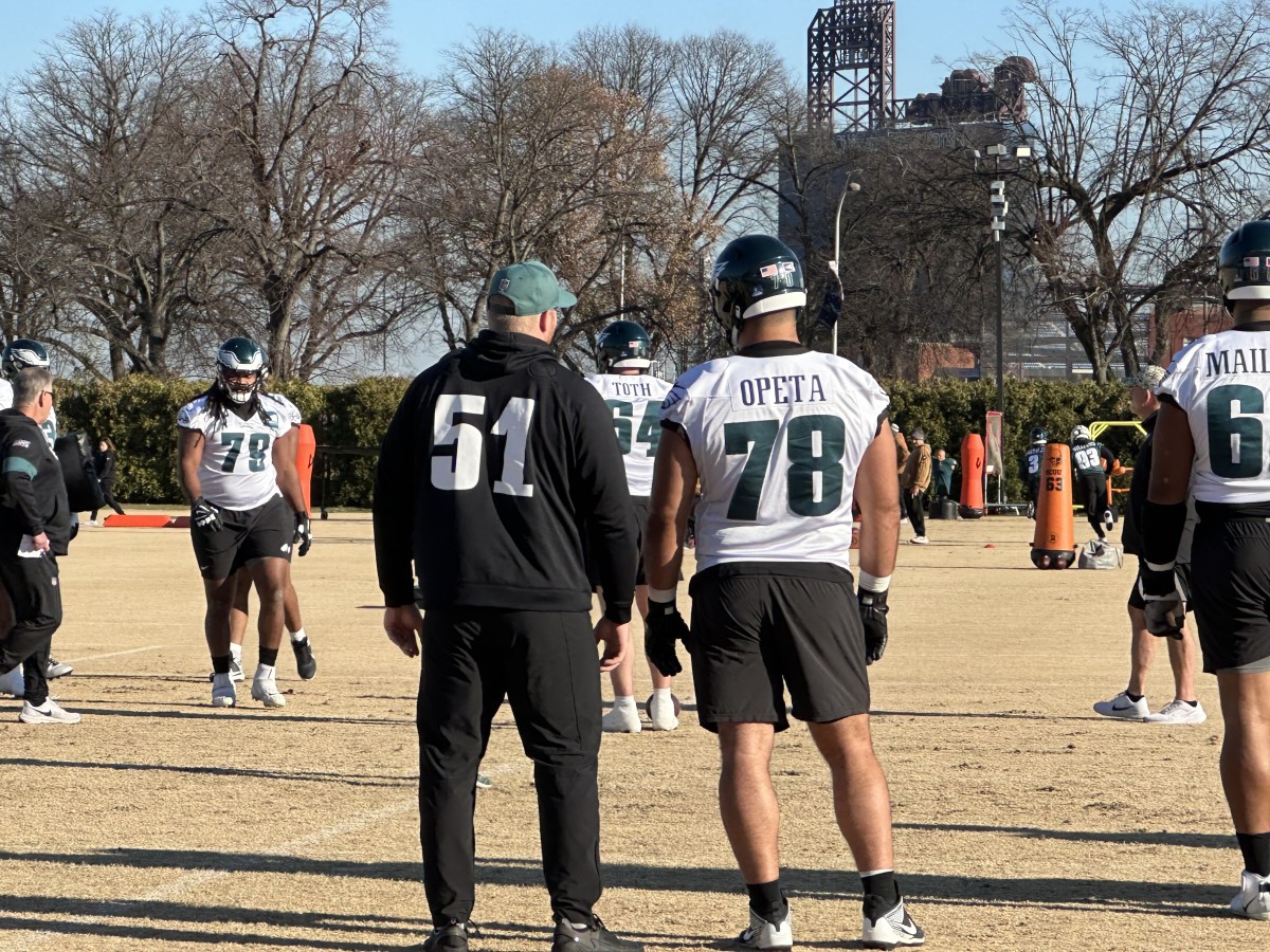 Cam Jurgens (left) goes over some pointers with Sua Opeta, who could make the Week 15 start in Seattle with Jurgens ruled out with a pec injury.
