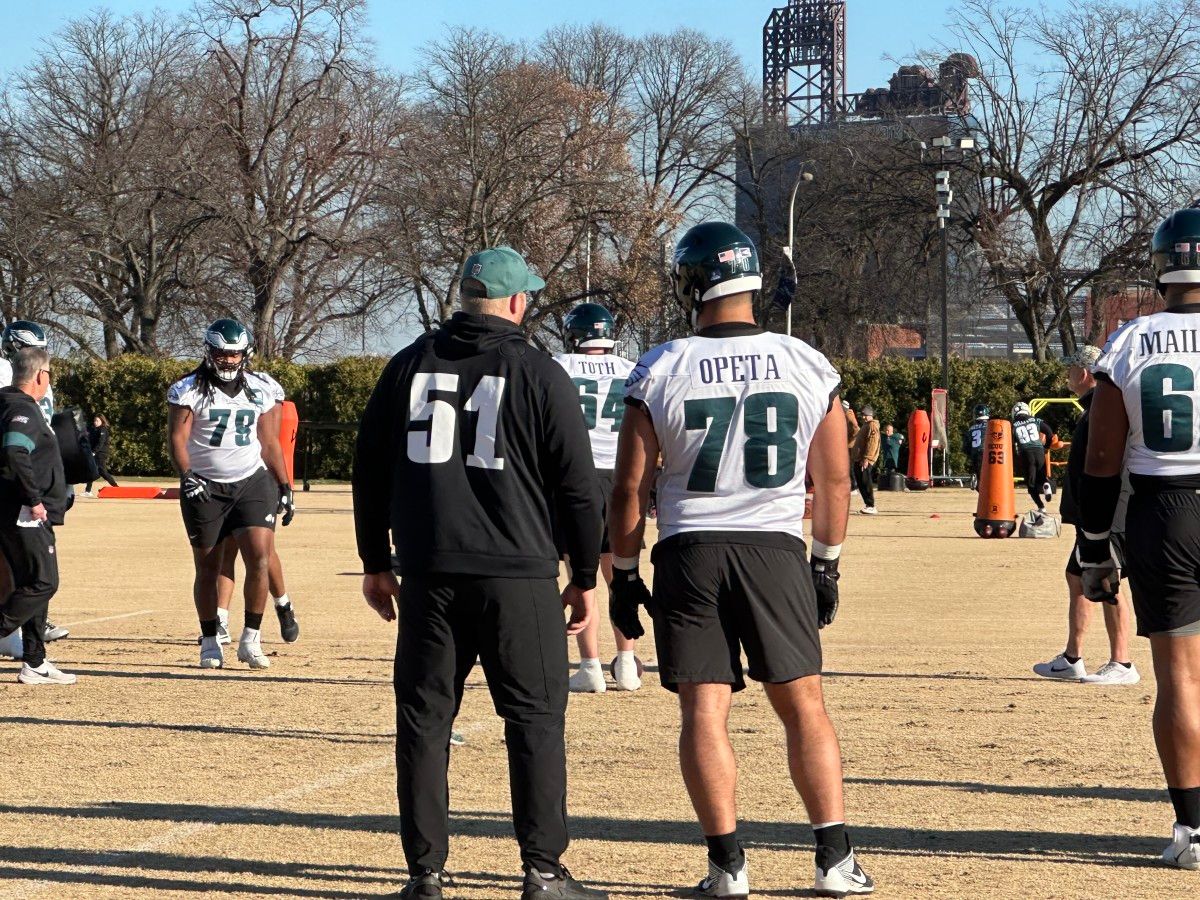 Cam Jurgens (left) goes over some pointers with Sua Opeta, who could make the Week 15 start in Seattle with Jurgens ruled out with a pec injury.