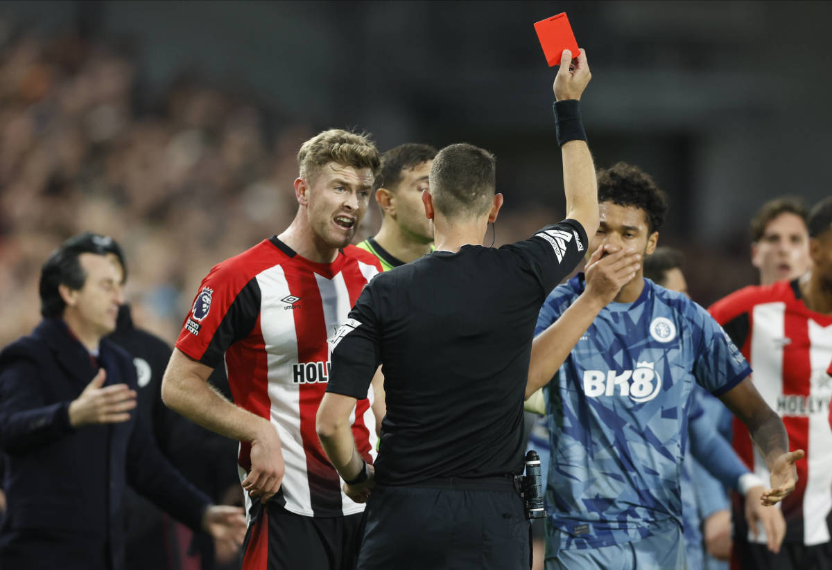 Referee David Coote pictured showing a red card to Boubacar Kamara (right) towards the end of Aston Villa's 2-1 win at Brentford in December 2023