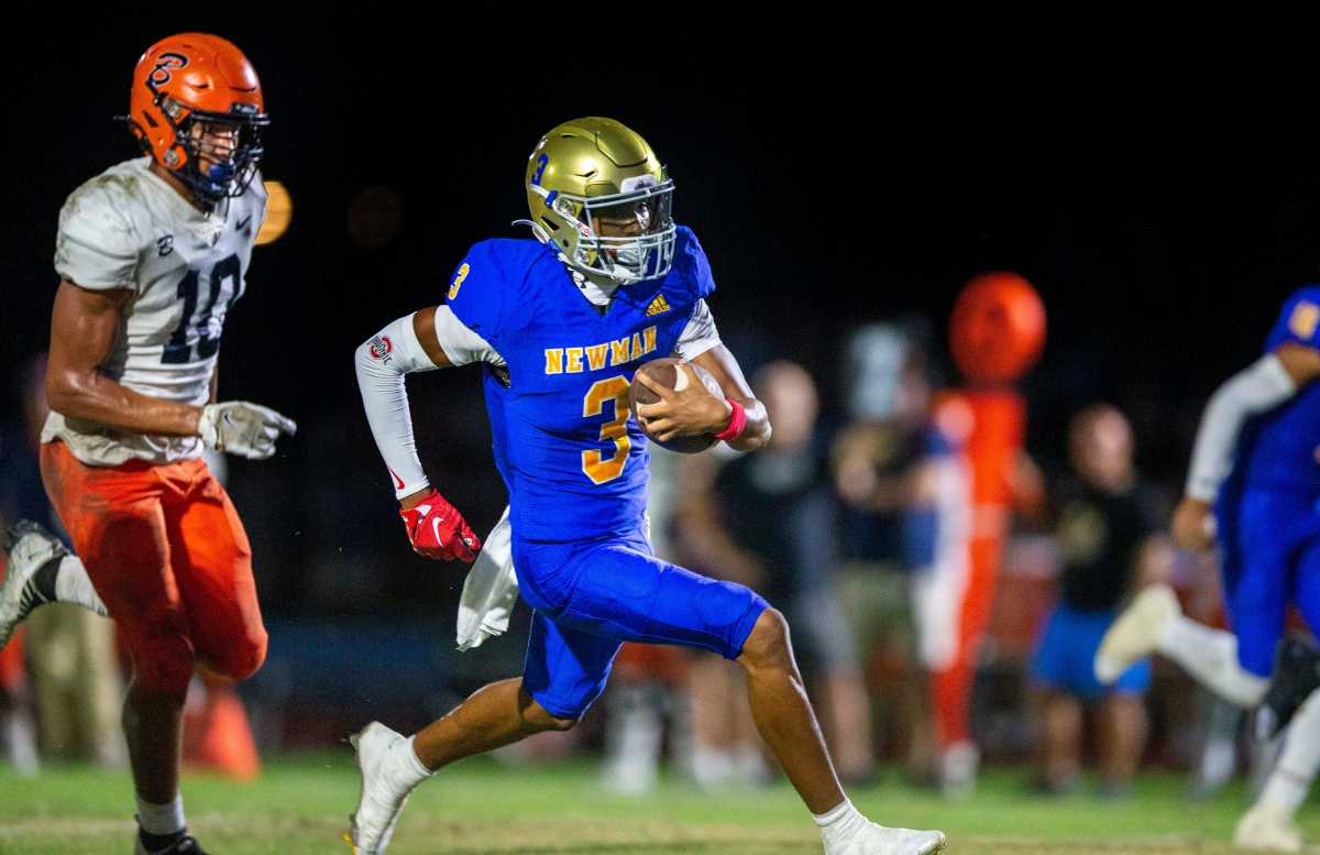 Cardinal Newman wide receiver Naeshaun Montgomery runs down the field against Benjamin in their regional semifinal playoff football game in West Palm Beach on November 17, 2023.