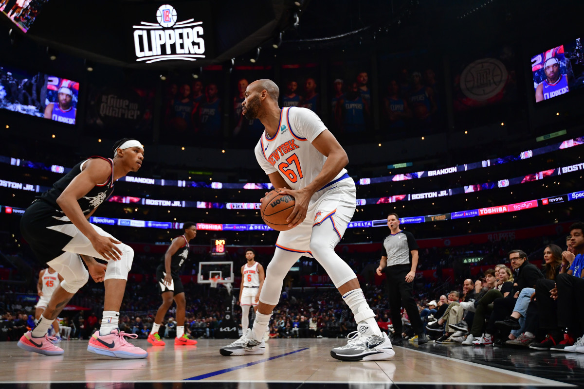 New York Knicks center Taj Gibson (67) controls the ball against Los Angeles Clippers guard Brandon Boston Jr. (4) during the second half at Crypto.com Arena.