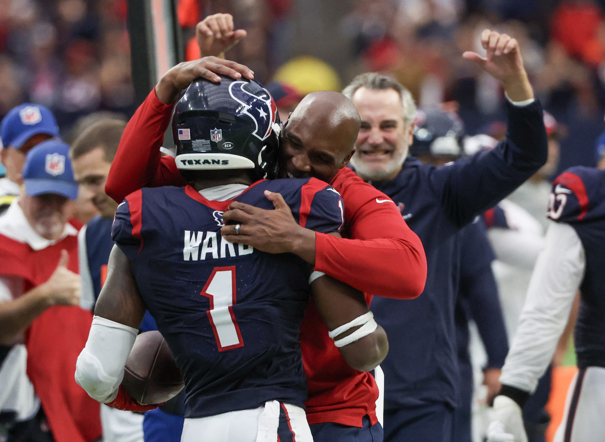 Houston Texans head coach DeMeco Ryans hugs safety Jimmie Ward (1) after he intercepted the ball against the Denver Broncos late in the fourth quarter at NRG Stadium.