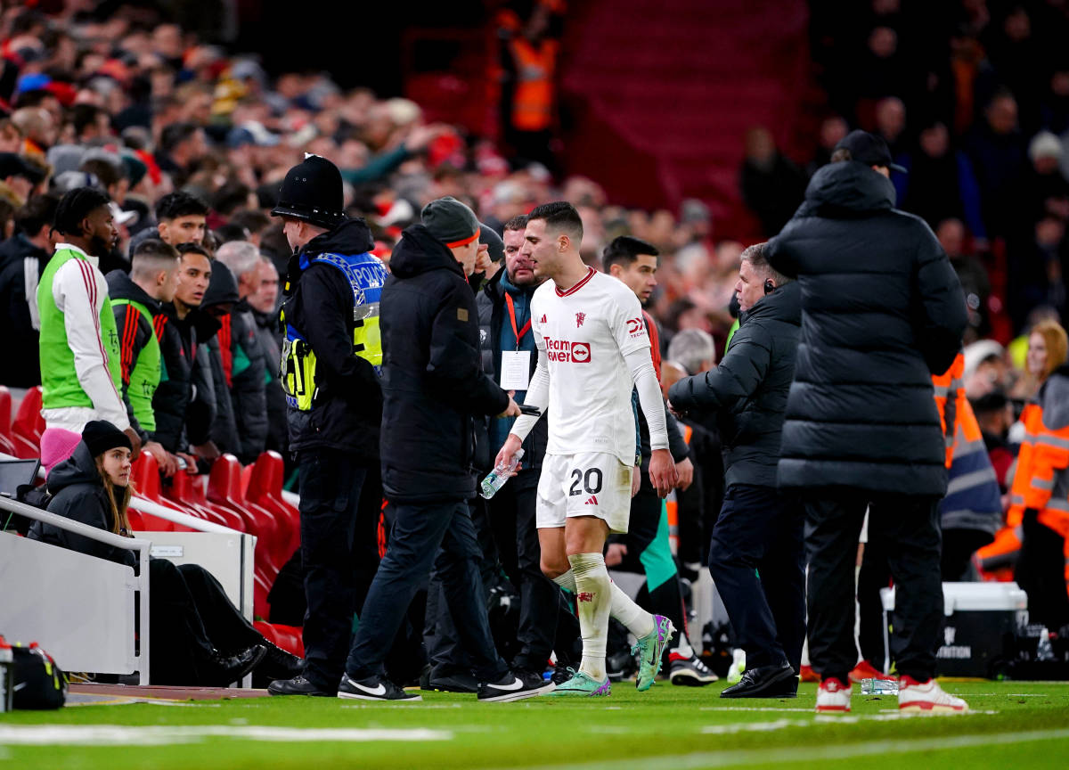 Manchester United defender Diogo Dalot pictured (center) moments after being sent off during a 0-0 draw with Liverpool at Anfield in December 2023