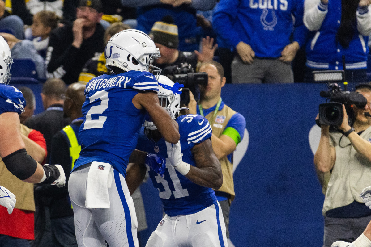 Dec 16, 2023; Indianapolis, Indiana, USA; Indianapolis Colts wide receiver D.J. Montgomery (2) celebrates his touchdown with teammates in the first half against the Pittsburgh Steelers at Lucas Oil Stadium. Mandatory Credit: Trevor Ruszkowski-USA TODAY Sports
