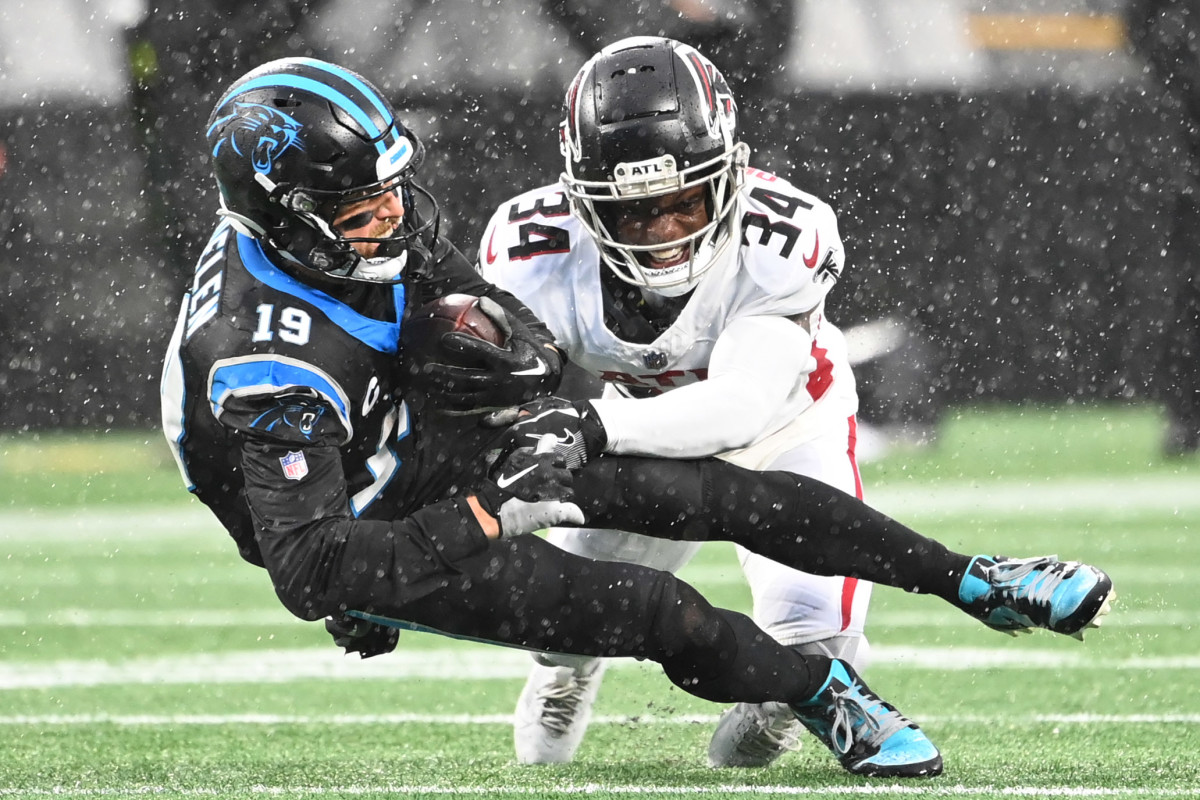 Carolina Panthers wide receiver Adam Thielen (19) is tackled by Atlanta Falcons cornerback Clark Phillips III (34) in the third quarter at Bank of America Stadium.