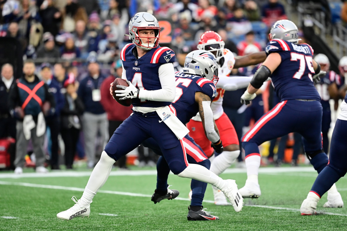 New England Patriots quarterback Bailey Zappe (4) on the move in the pocket during the second half against the Kansas City Chiefs at Gillette Stadium.