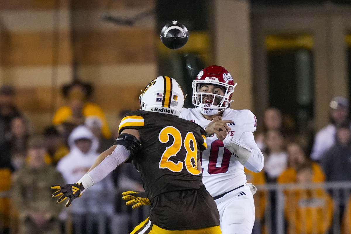 Oct 7, 2023; Laramie, Wyoming, USA; Fresno State Bulldogs quarterback Logan Fife (10) throw against Wyoming Cowboys linebacker Easton Gibbs (28) during the fourth quarter at Jonah Field at War Memorial Stadium.