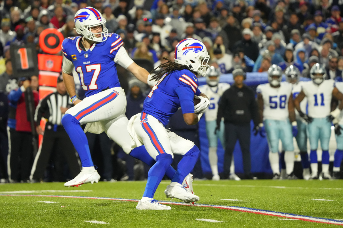 Bills RB James Cook takes a handoff from QB Josh Allen in a win against the Dallas Cowboys.