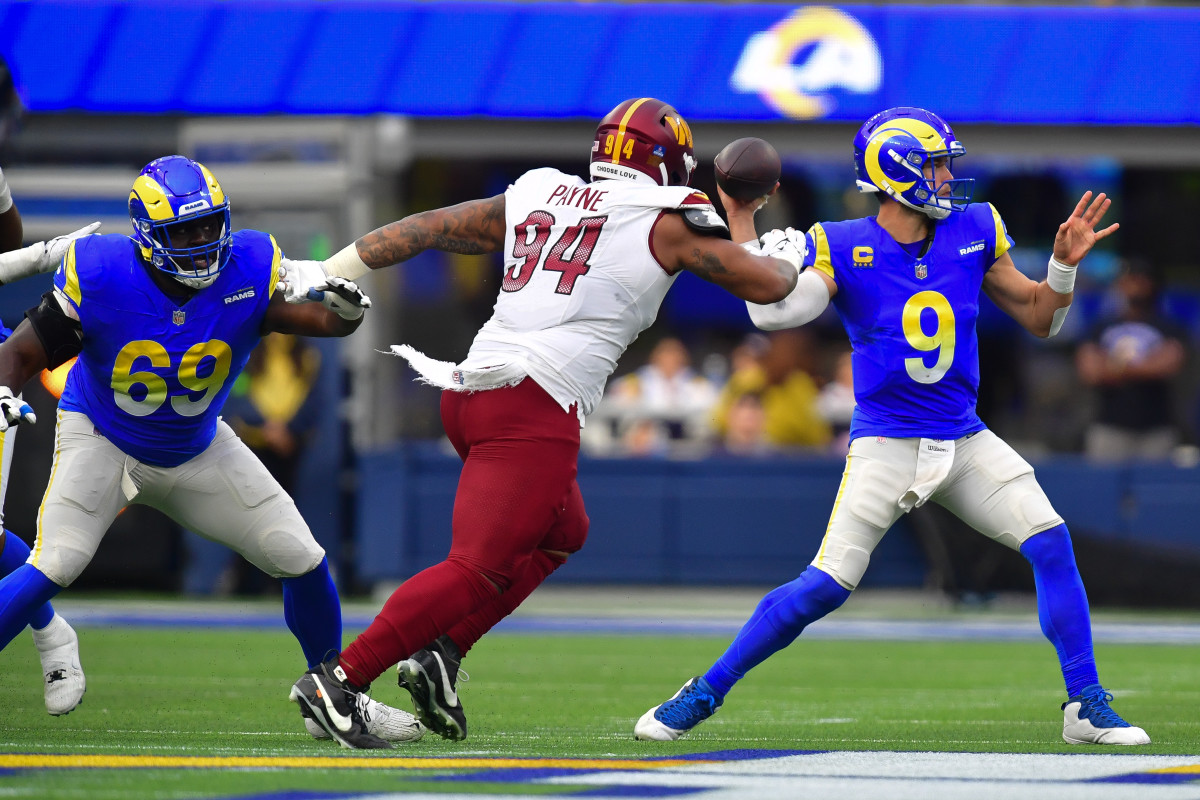Dec 17, 2023; Inglewood, California, USA; Los Angeles Rams quarterback Matthew Stafford (9) throws as Washington Commanders defensive tackle Daron Payne (94) moves in during the first half at SoFi Stadium.