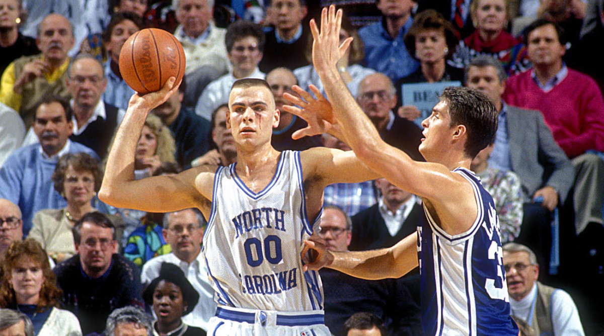 North Carolina Tar Heels center Eric Montross (00) looks to pass as Duke center Christian Laettner (32) defends in the Tar Heels 75-73 victory against the Blue Devils at the Dean E. Smith Center.