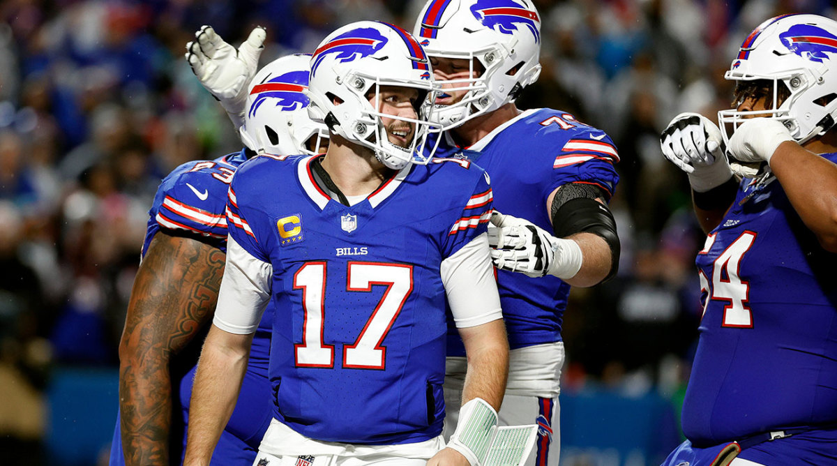 A group of Bills linemen celebrate with Josh Allen after a touchdown run