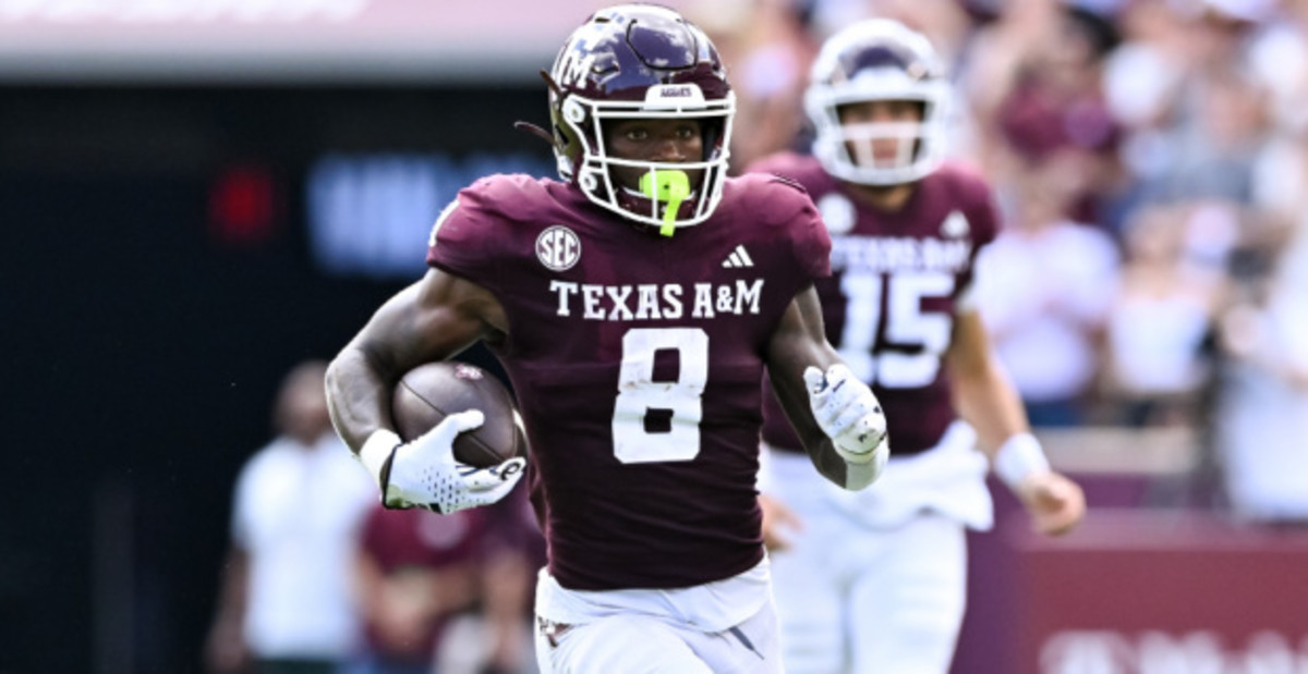 Texas A&M running back Le'Veon Moss on a rushing attempt during a college football game in the SEC.