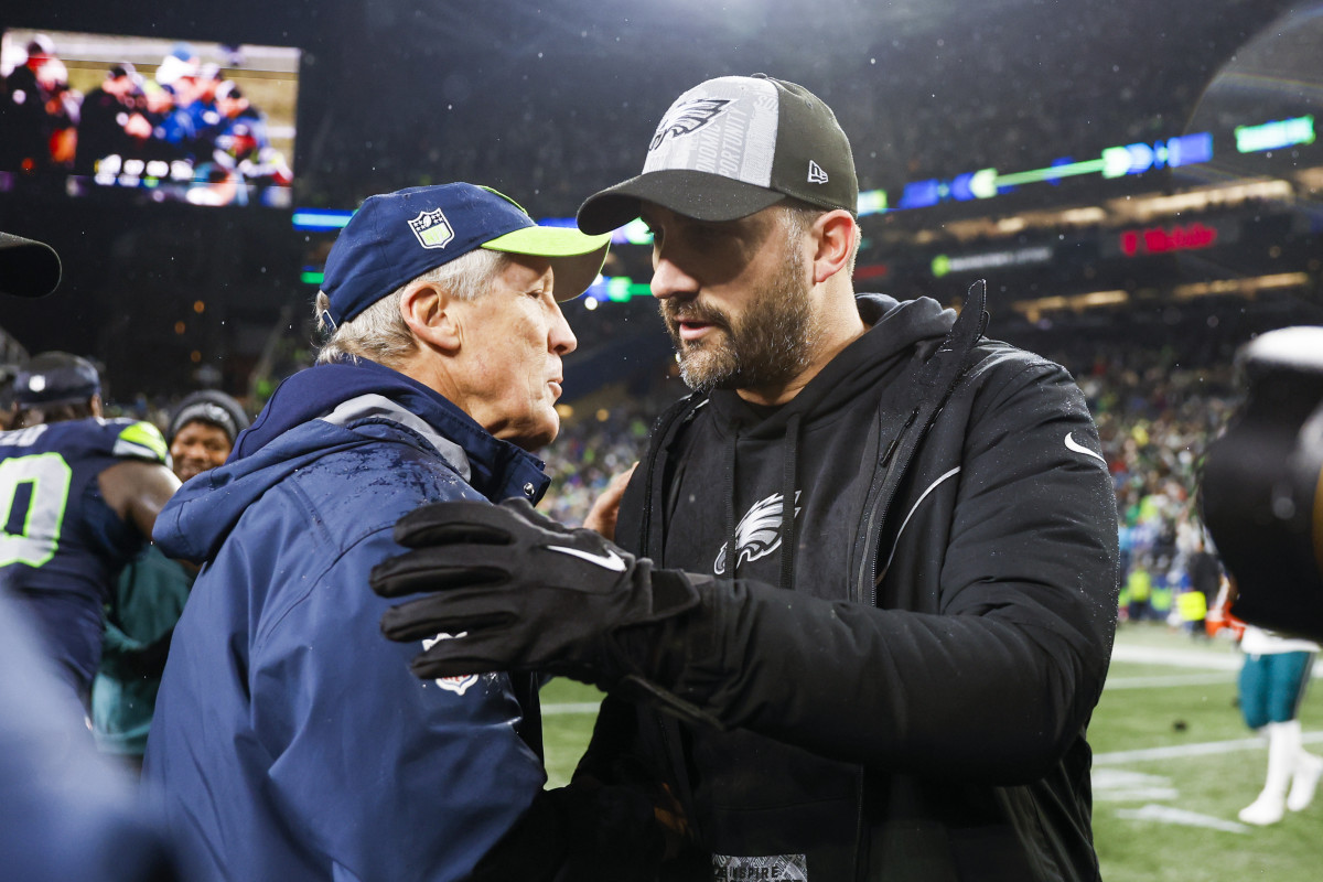 Seattle Seahawks head coach Pete Carroll shakes hands with Philadelphia Eagles head coach Nick Sirianni following a 20-17 Seattle victory at Lumen Field.