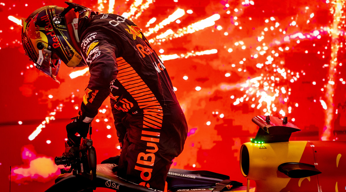 Max Verstappen with his Red Bull Racing car.