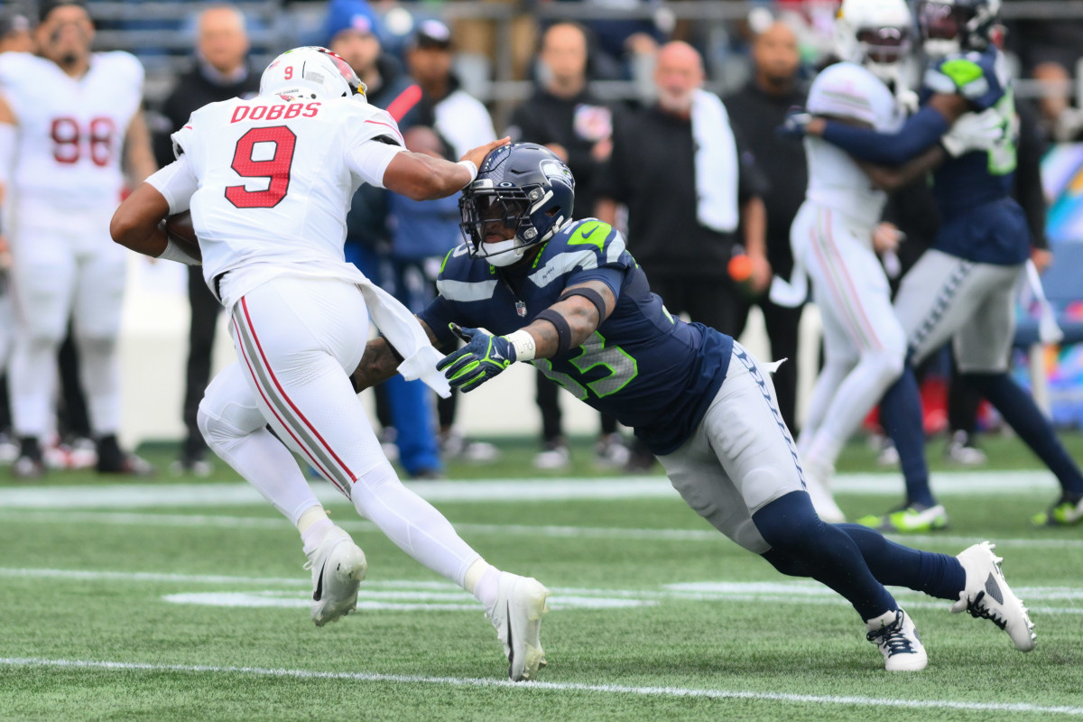 Seattle Seahawks safety Jamal Adams (33) dives for Arizona Cardinals quarterback Joshua Dobbs (9) during the game at Lumen Field.
