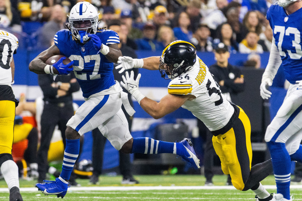 Dec 16, 2023; Indianapolis, Indiana, USA; Indianapolis Colts running back Trey Sermon (27) runs the ball while Pittsburgh Steelers linebacker Alex Highsmith (56) defends in the second half at Lucas Oil Stadium.