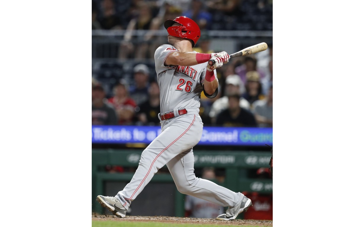 Cincinnati Reds right fielder TJ Hopkins hits a single against the Pittsburgh Pirates during the tenth inning at PNC Park. (2023)