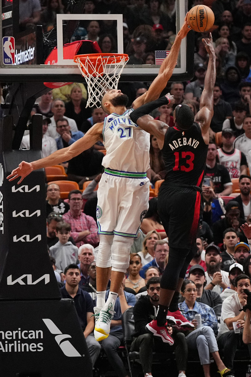 Dec 18, 2023; Miami, Florida, USA; Minnesota Timberwolves center Rudy Gobert (27) blocks the shot of Miami Heat center Bam Adebayo (13) during the second half at Kaseya Center.