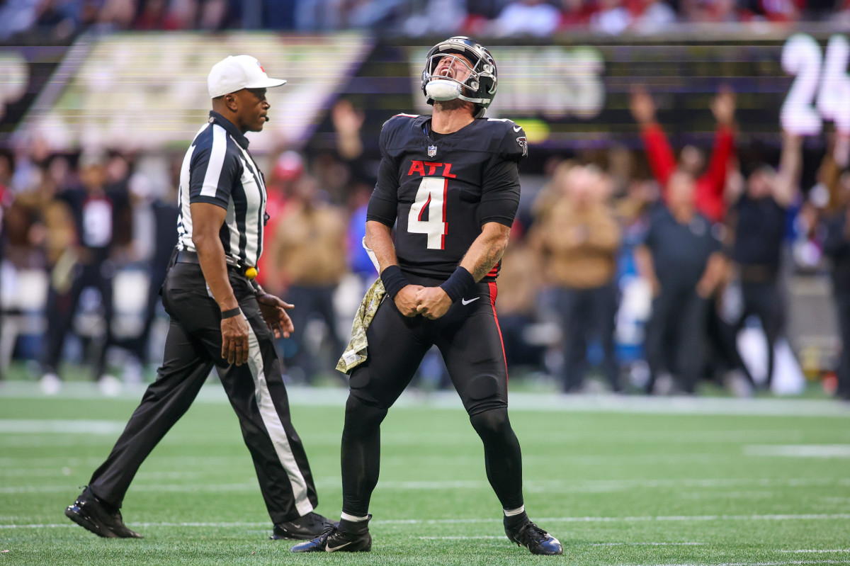 Nov 5, 2023; Atlanta, Georgia, USA; Atlanta Falcons quarterback Taylor Heinicke (4) reacts after a touchdown against the Minnesota Vikings in the second half at Mercedes-Benz Stadium.