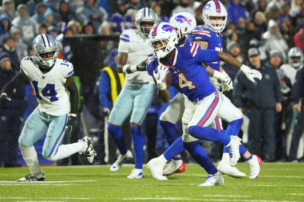 Dec 17, 2023; Orchard Park, New York, USA; Buffalo Bills running back James Cook (4) runs the ball in for a touch down in the second half against the Dallas Cowboys at Highmark Stadium. 