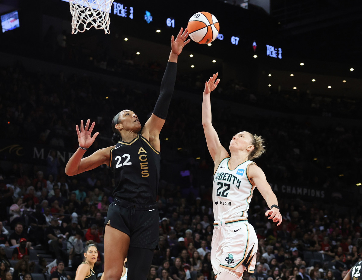 Aces forward A’ja Wilson blocks a shot by the Liberty’s Courtney Vandersloot in the 2023 WNBA Finals.