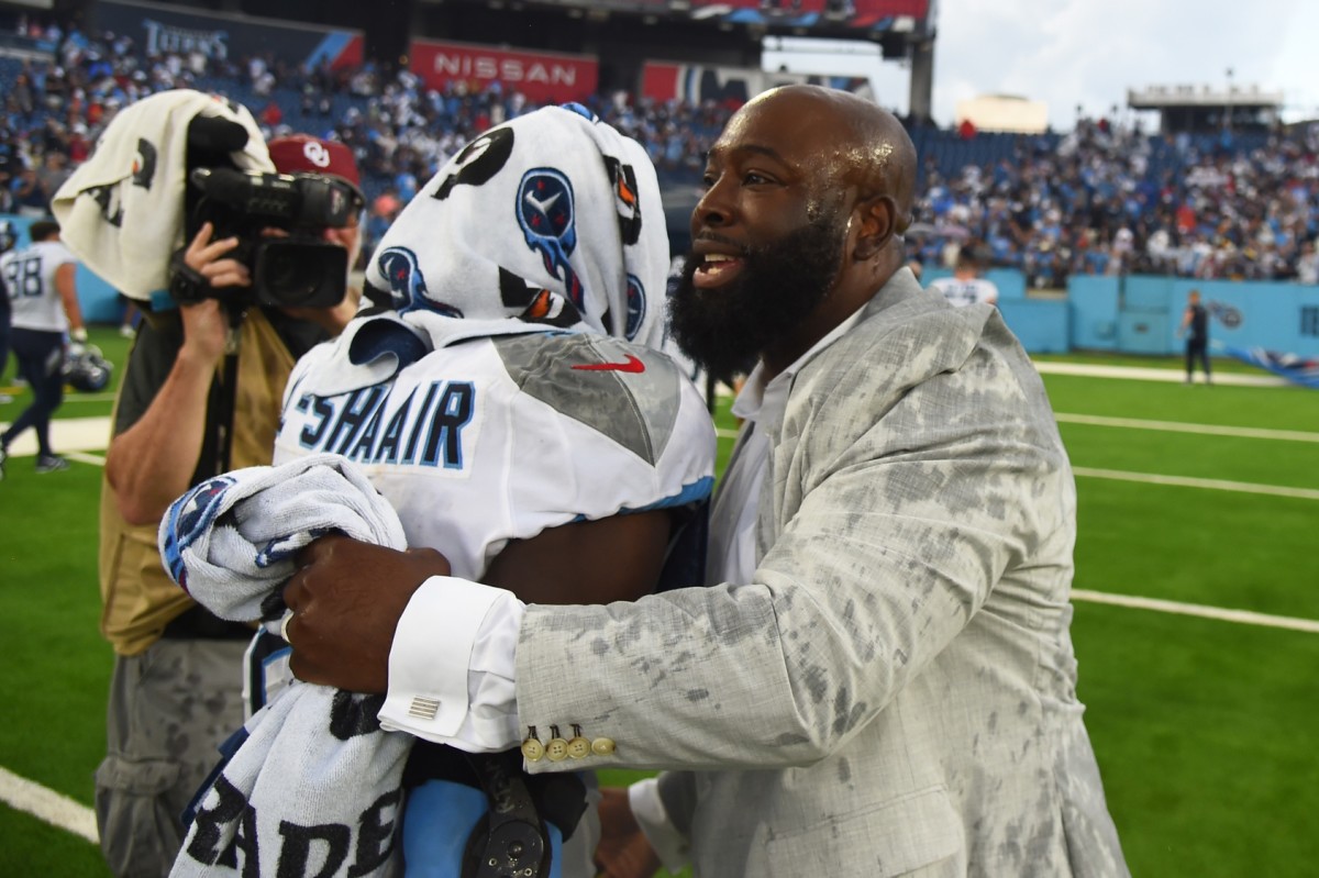 Sep 17, 2023; Nashville, Tennessee, USA; Tennessee Titans general manager Ran Carthon celebrates with linebacker Azeez Al-Shaair (2) after a win against the Los Angeles Chargers at Nissan Stadium. Mandatory Credit: Christopher Hanewinckel-USA TODAY Sports
